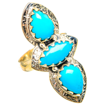 Sterling silver turquoise ring with three teardrop stones in an ornate raised frame