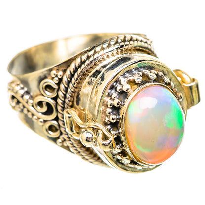 Sterling silver opal ring with oval Ethiopian opal and ornate filigree bezel, gold-tone accents