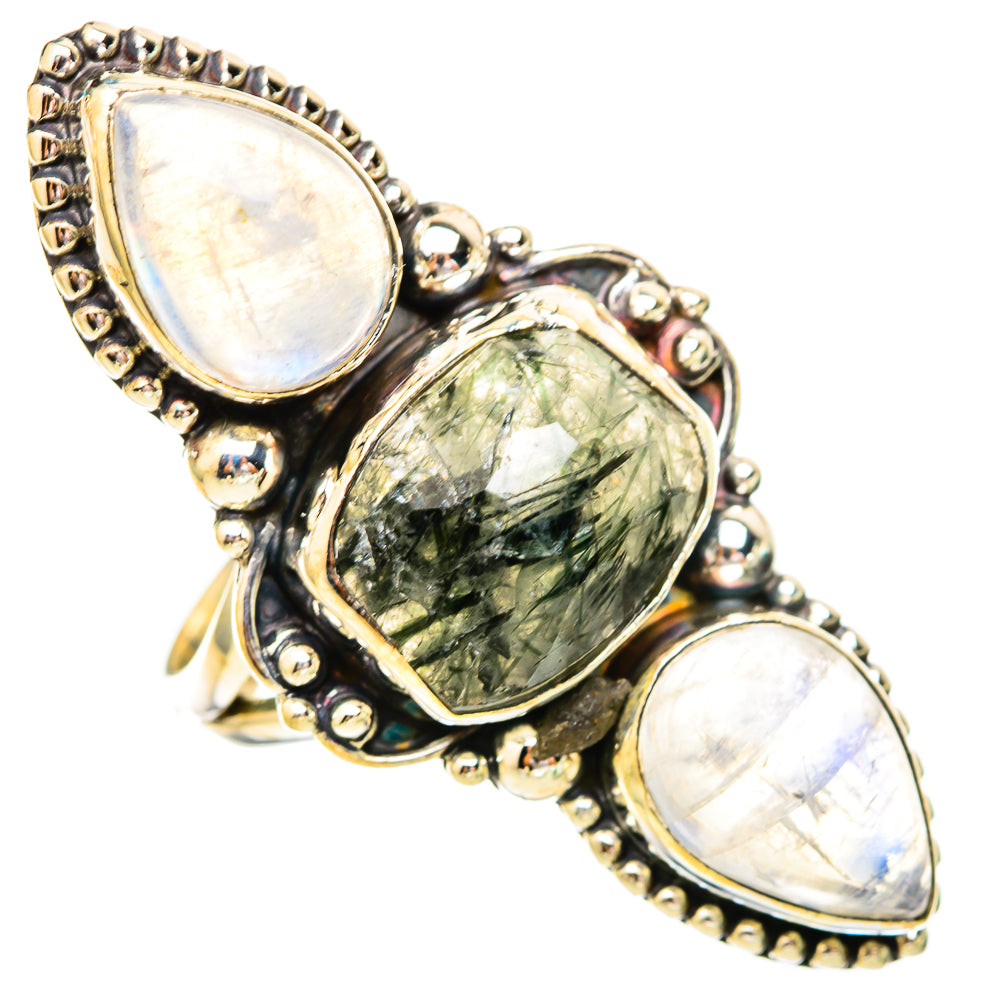 Sterling silver ring with two iridescent oval stones and green-black faceted center gem