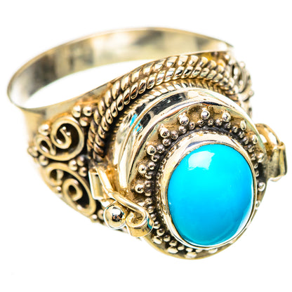 Turquoise oval gemstone ring with ornate filigree bezel, silver-tone setting