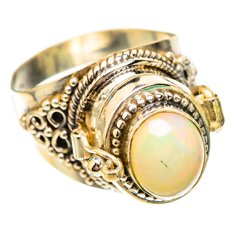 Sterling silver opal ring, oval cabochon set in ornate circular filigree