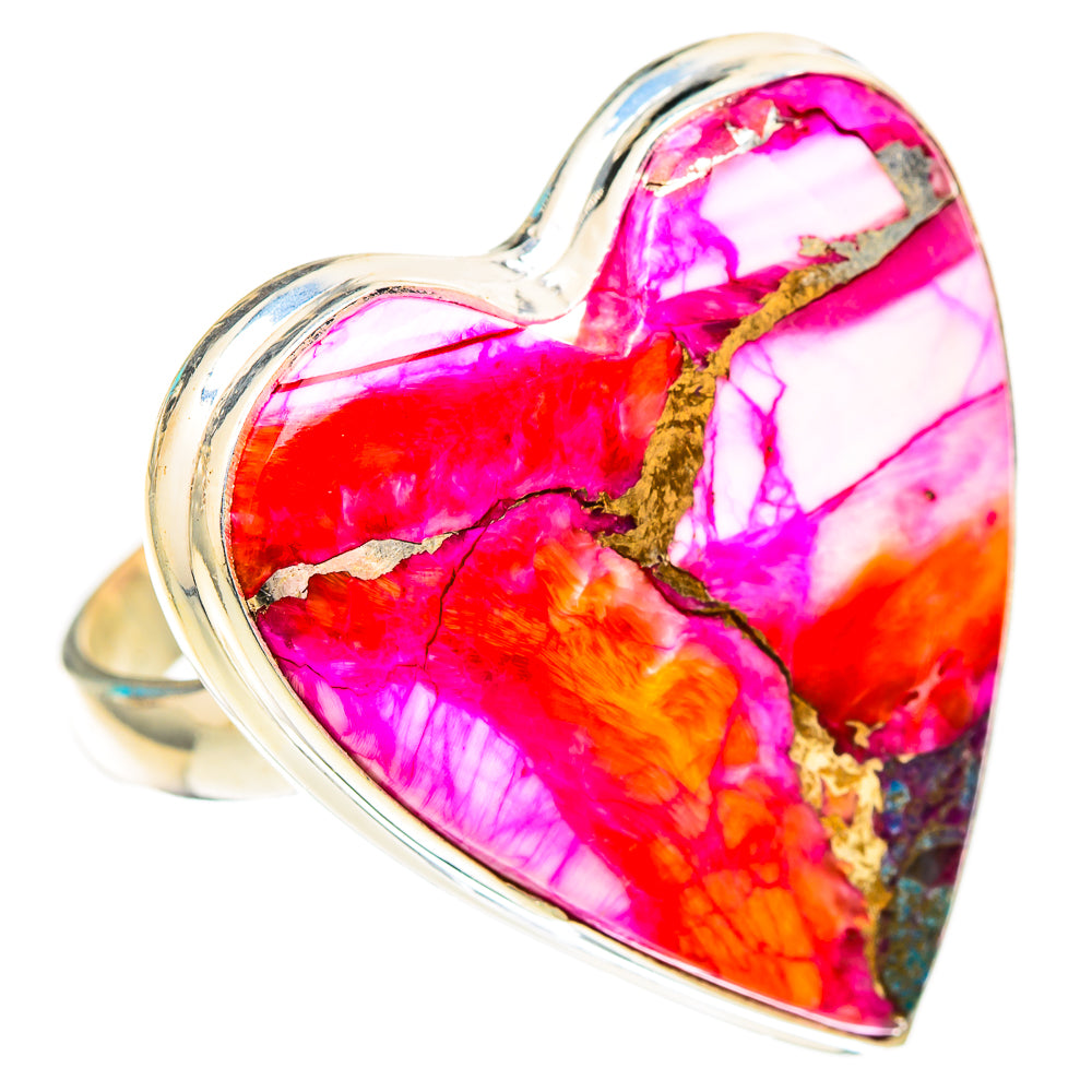 Heart-shaped gemstone ring with bright pink, orange, and gold veining on a silver band