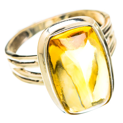 Sterling silver ring set with faceted sugarloaf citrine gemstone, angled view of band