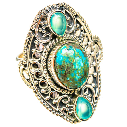 Filigree sterling silver ring with central turquoise oval cabochon and two side turquoise stones