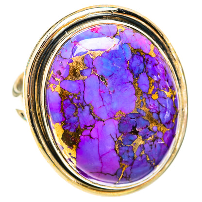 Large oval purple turquoise cabochon ring with gold matrix in silver bezel