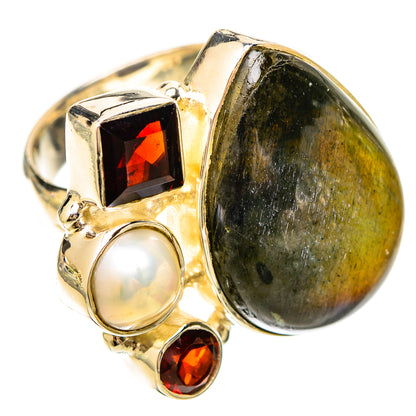 Sterling silver ring with large oval labradorite, white pearl, and red garnet stones