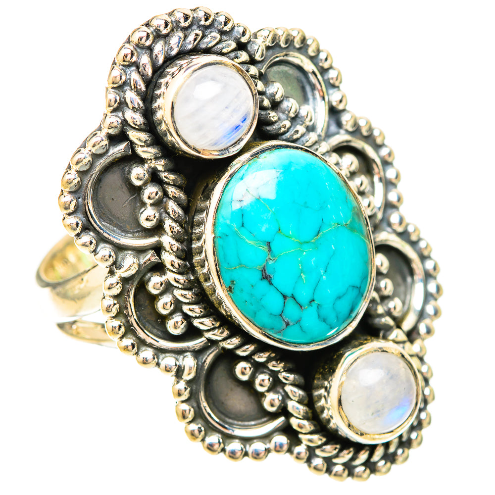 Ornate silver-tone ring with oval turquoise center stone and two opalescent side stones