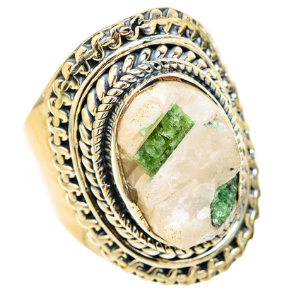 Oval silver ring with green tourmaline in quartz set in ornate twisted bezel