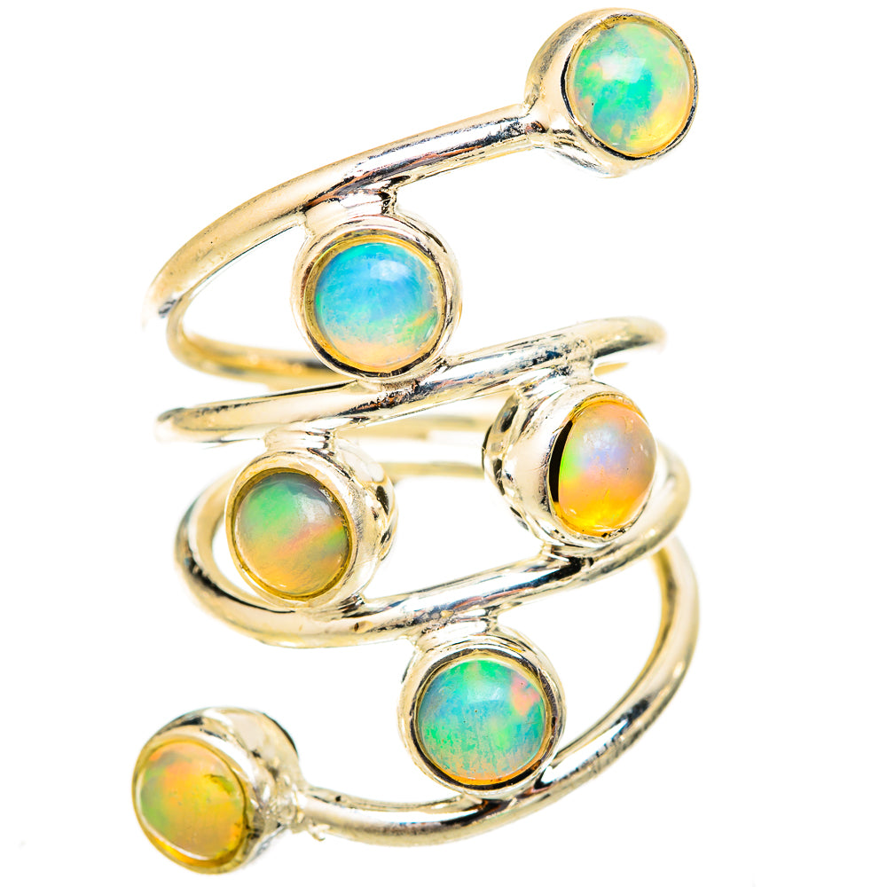 Gold-tone opal ring with five round cabochons and a layered, curved band