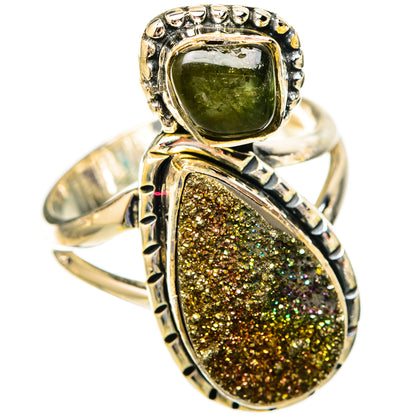 Sterling silver ring with bezel-set green stone and oval gold-speckled druzy