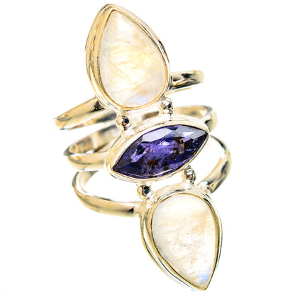 Silver ring with three oval stones: two rainbow moonstone and faceted dark blue center
