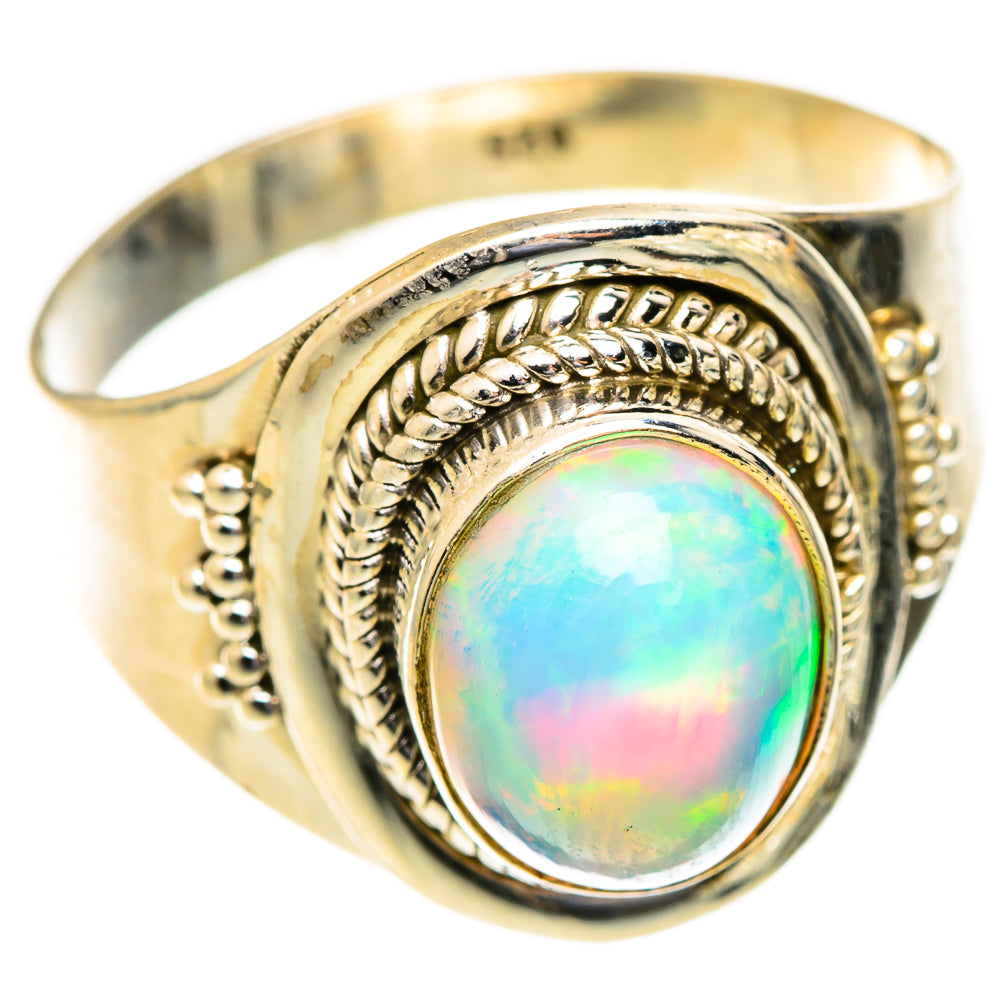 Silver opal ring with oval bezel and decorative rope engraving