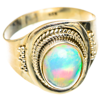 Silver opal ring with oval bezel and decorative rope engraving