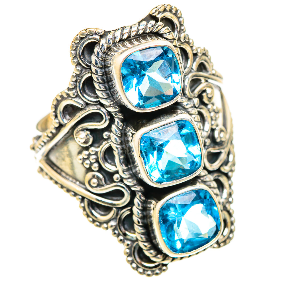 Sterling silver ring with three square blue topaz gemstones, ornate filigree setting