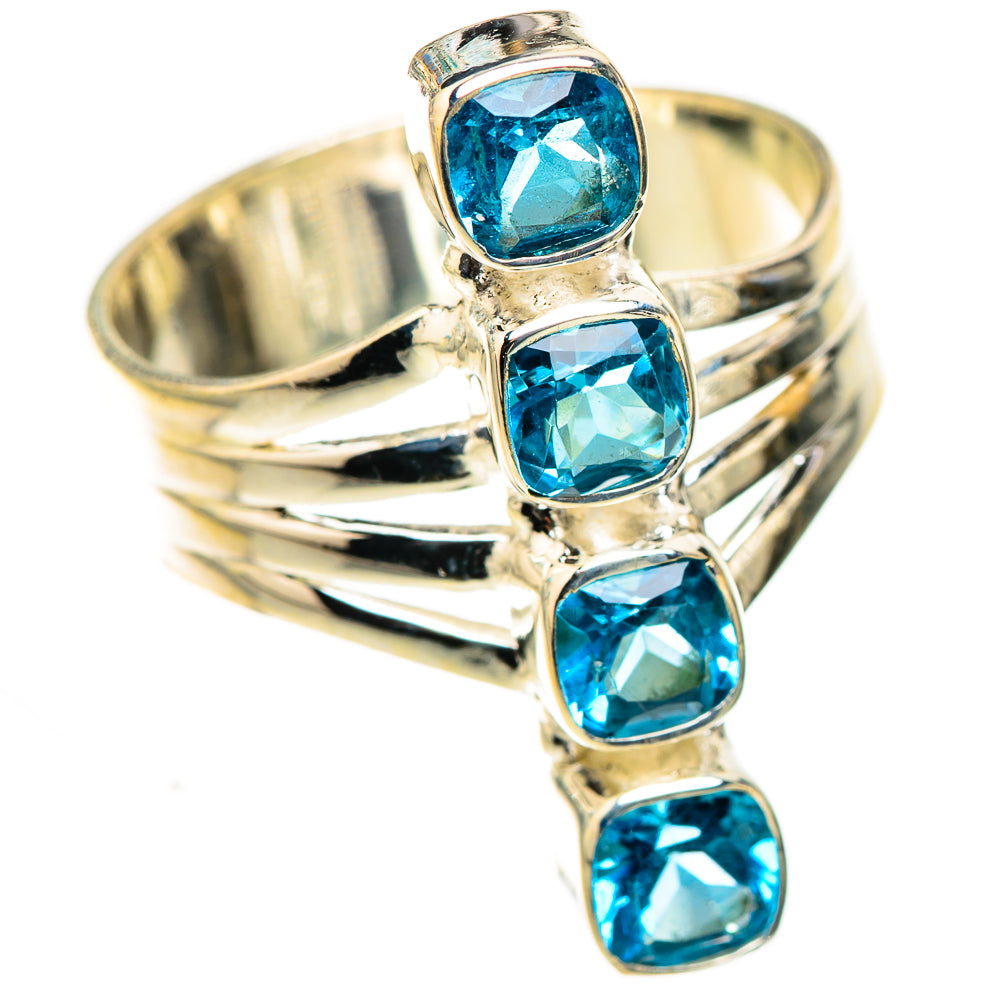 Sterling silver ring with four blue oval gemstones and ridged band