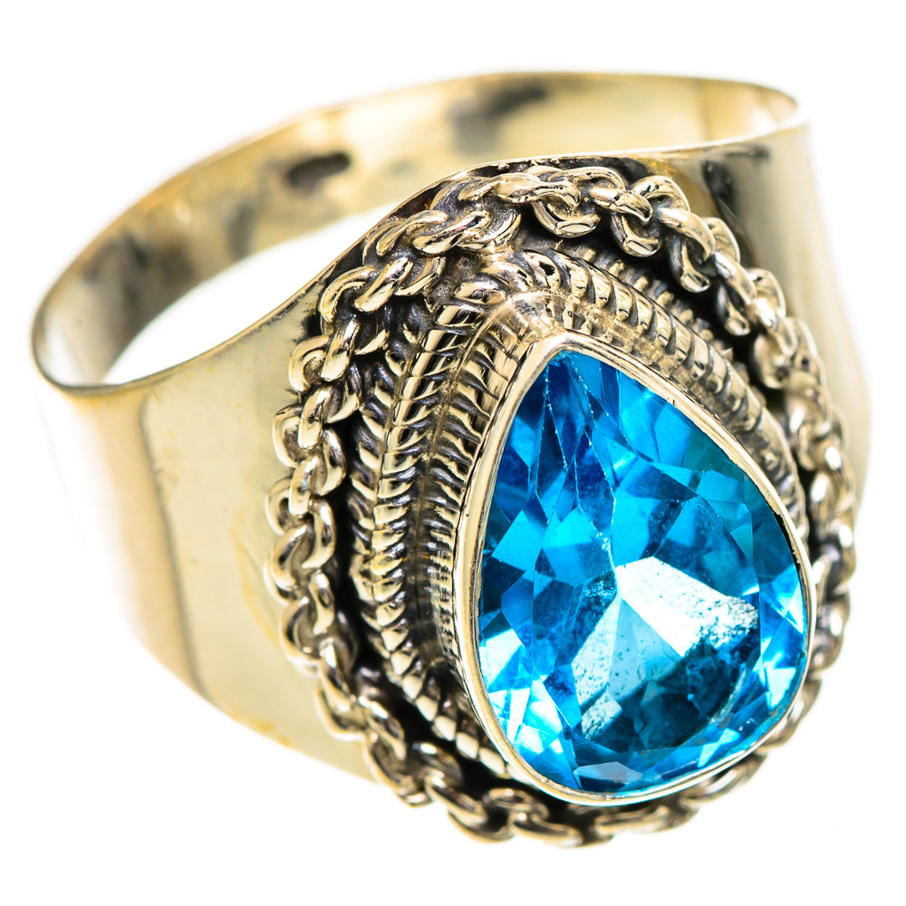 Sterling silver ring with oval blue gemstone, ornate rope prong setting