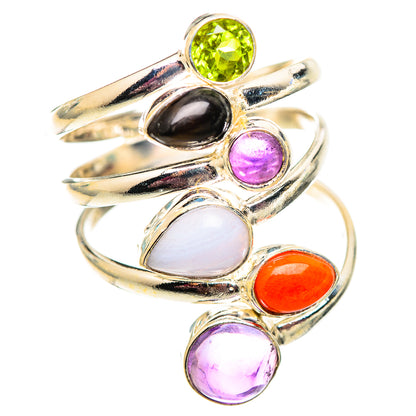 Sterling silver ring with oval stones in green, black, purple, white, and orange