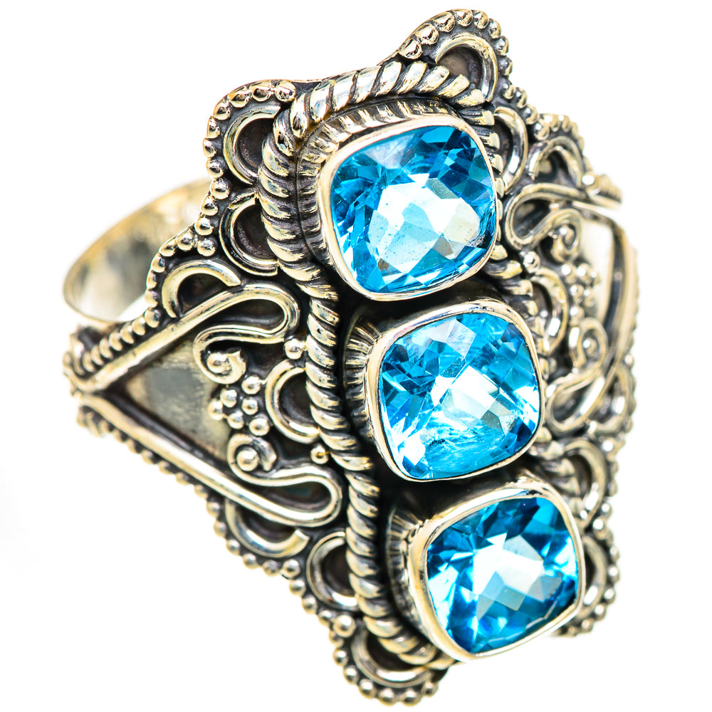 Sterling silver ring with three blue topaz stones in ornate filigree setting