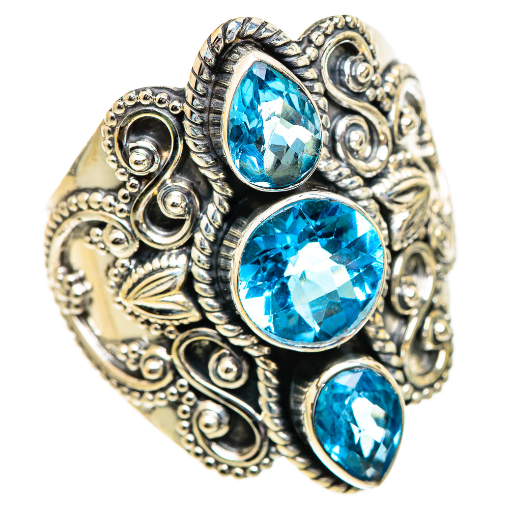 Sterling silver ring with three oval Swiss blue topaz stones in detailed scrolling prongs