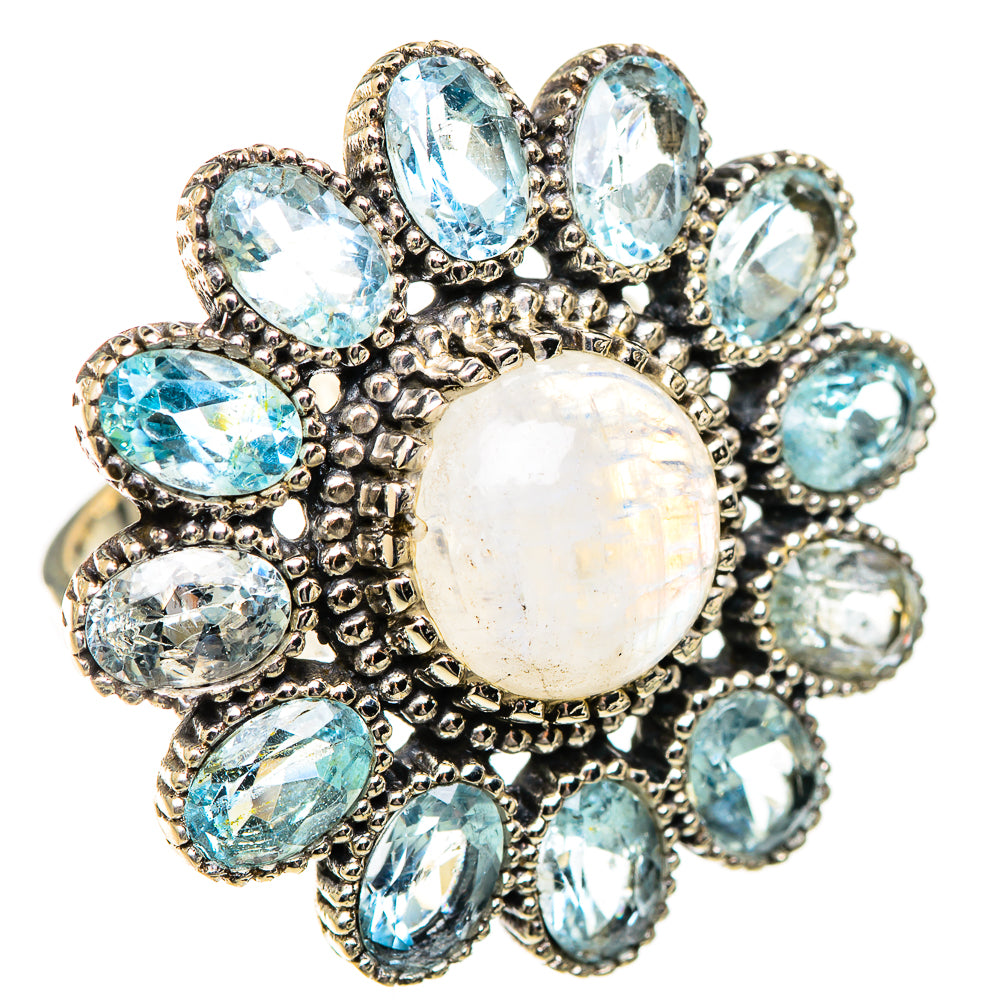 Silver statement ring with large opalescent moonstone center and blue oval stones