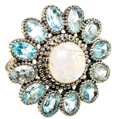 Silver statement ring with large opalescent moonstone center and blue oval stones
