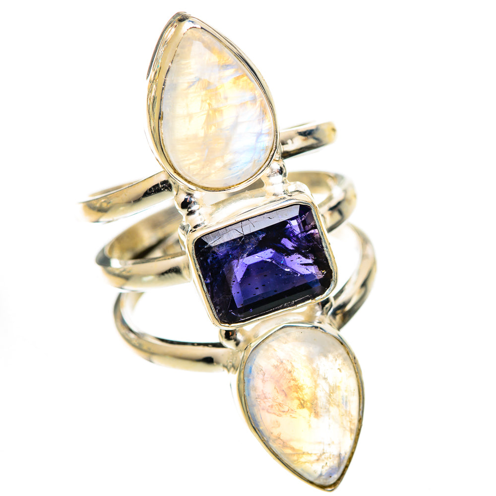 Sterling silver ring with three stones: oval opal-like sides and purple faceted center