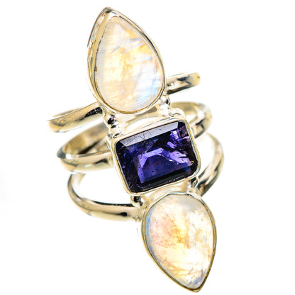 Sterling silver ring with three stones: oval opal-like sides and purple faceted center
