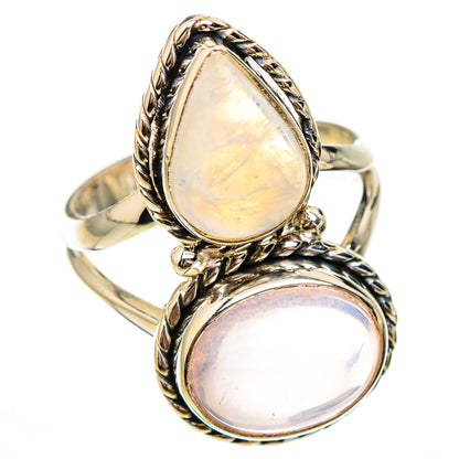 Two-stone sterling silver ring with stacked iridescent and pale teardrop cabochons, ornate setting