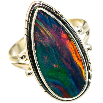 Opal ring with oval/tear iridescent opal stone in silver bezel with side prongs