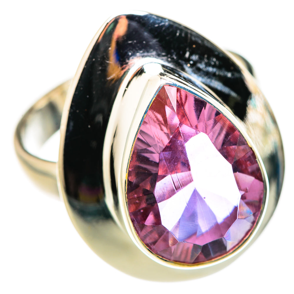 Sterling silver ring with oval color-change gemstone, pink center with violet flash