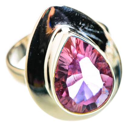 Sterling silver ring with oval color-change gemstone, pink center with violet flash