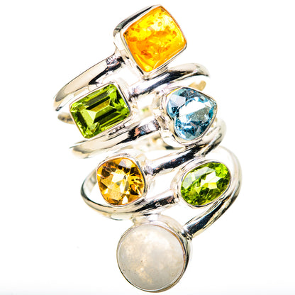 Silver ring with oval moonstone and colorful bezel-set stones: amber, blue, green, yellow.
