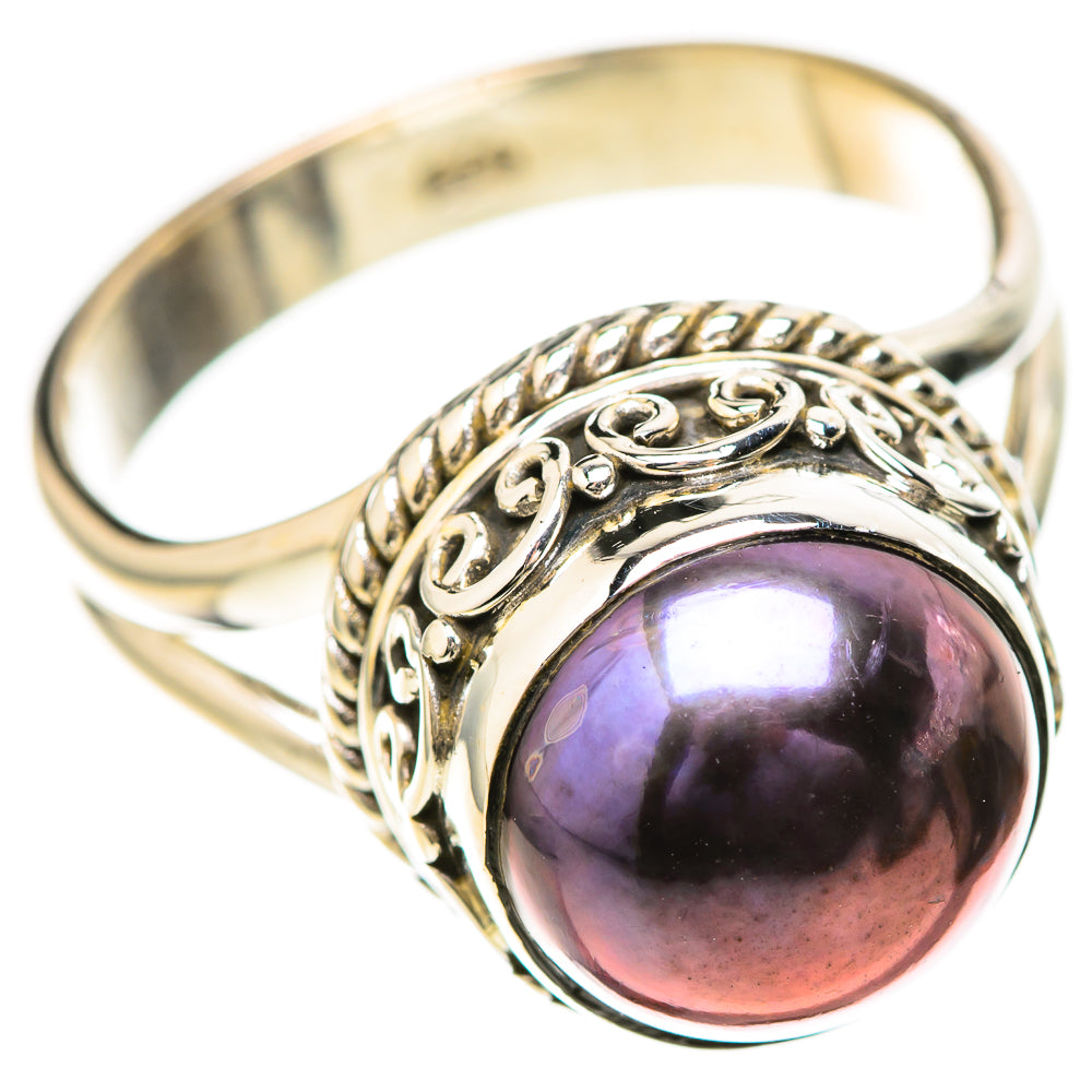 Silver-tone filigree ring with round purple iridescent gemstone-style centerpiece