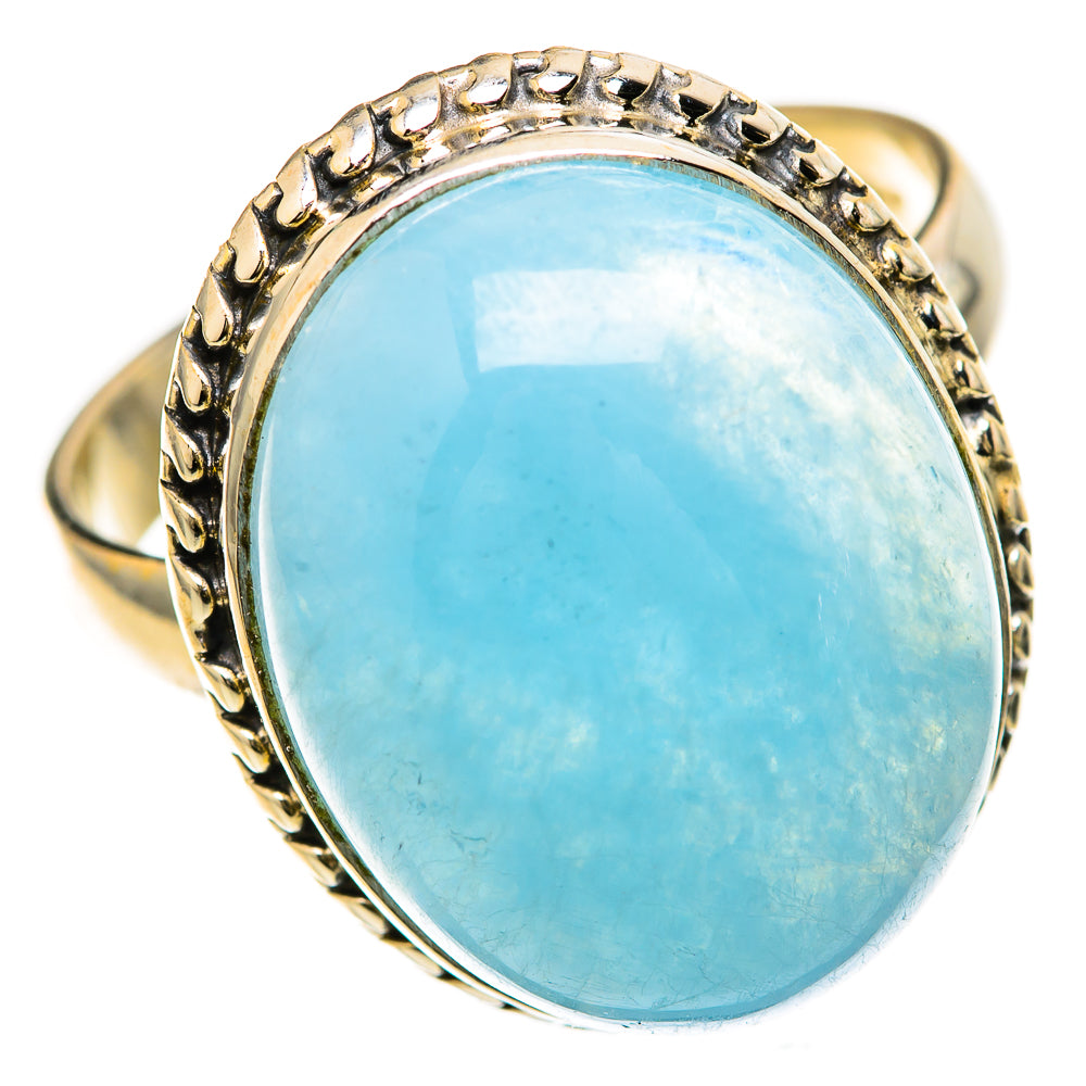 Oval aquamarine ring with gold-tone prong setting and light blue gemstone