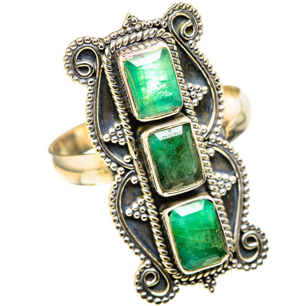 Gold-tone ring with three square green stones in an ornate beaded halo setting