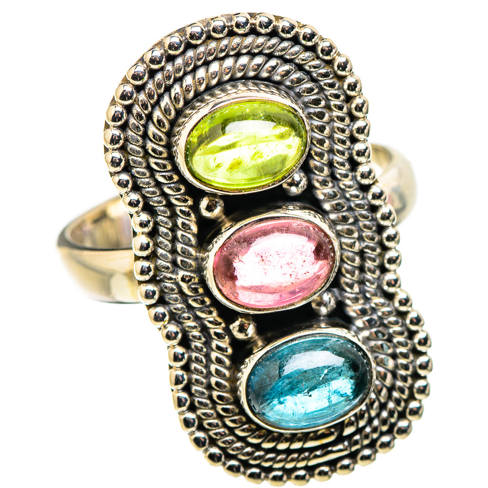 Sterling silver ring with three oval gemstones: green, pink, and blue in bead frame