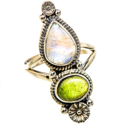 Ornate sterling-silver ring with pear moonstone and round green gemstone
