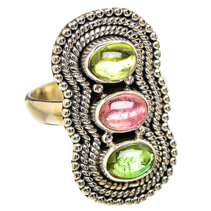 Gold-tone oval cabochon ring with two green and one pink tourmaline stone bezels