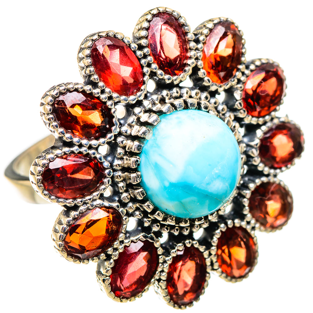 Sterling silver ring with oval turquoise Larimar center and red garnet cluster, side angle