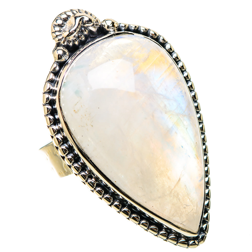 Teardrop moonstone ring with ornate side accents and round beaded border in silver