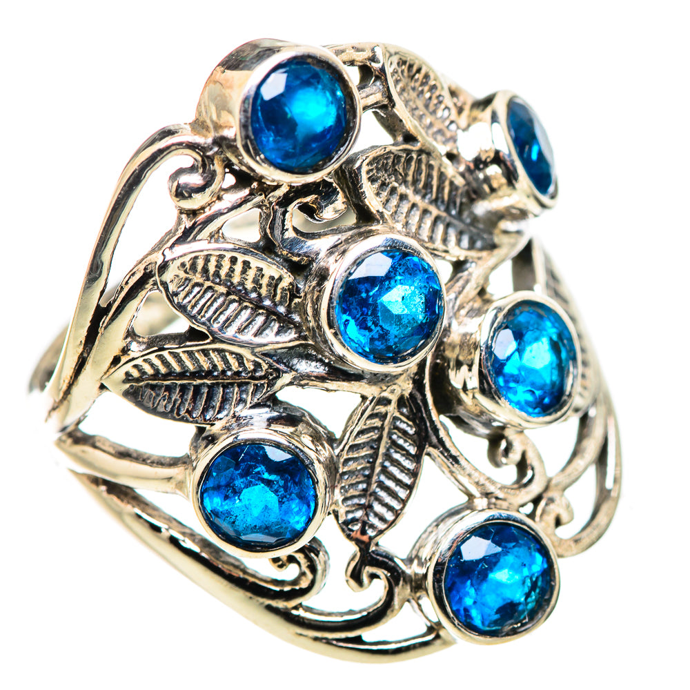 Silver filigree ring with multiple round blue gemstones and leaf cutouts