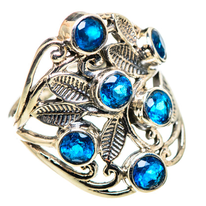 Silver filigree ring with multiple round blue gemstones and leaf cutouts