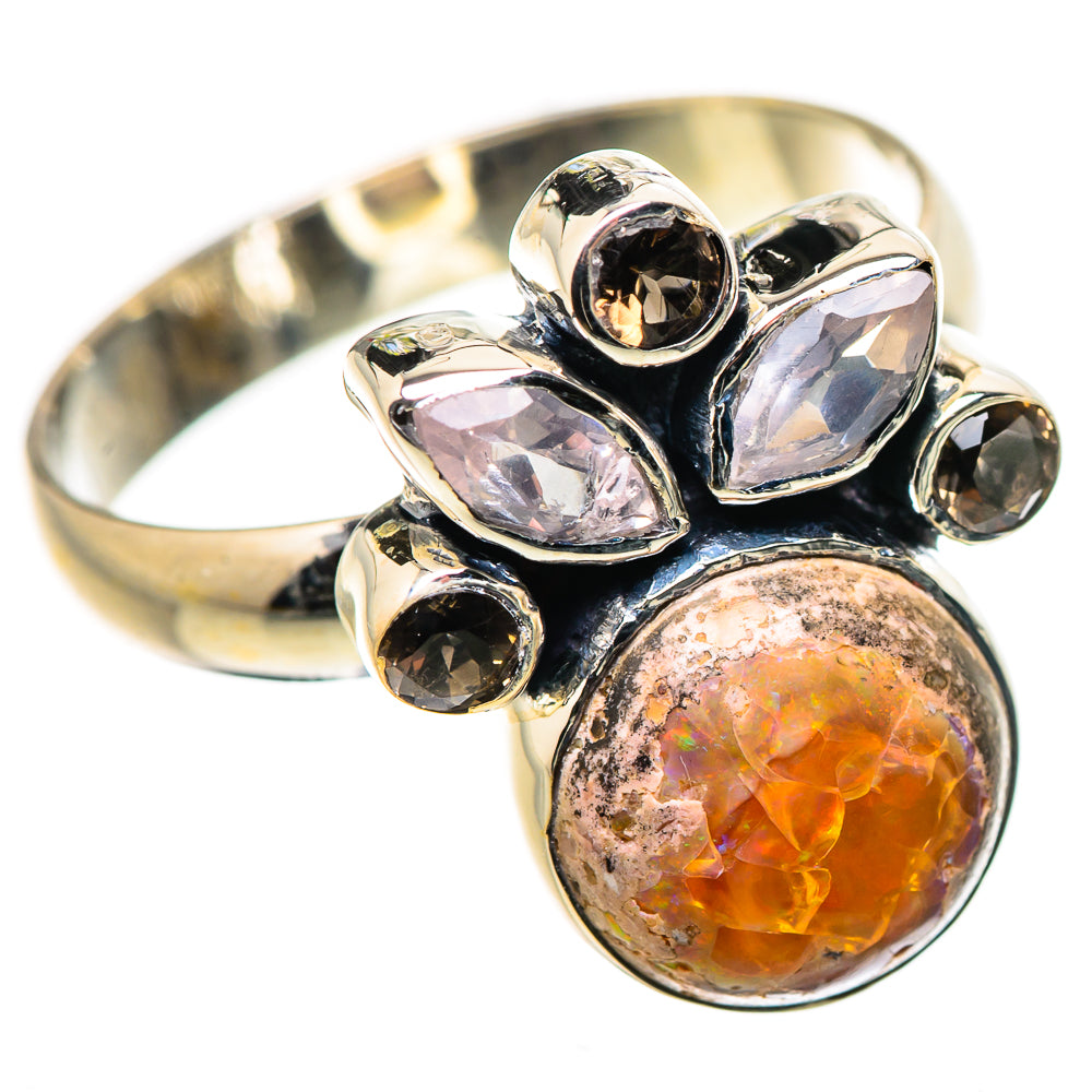 Sterling silver ring with large orange gemstone bezel and clear and smoky-toned side stones