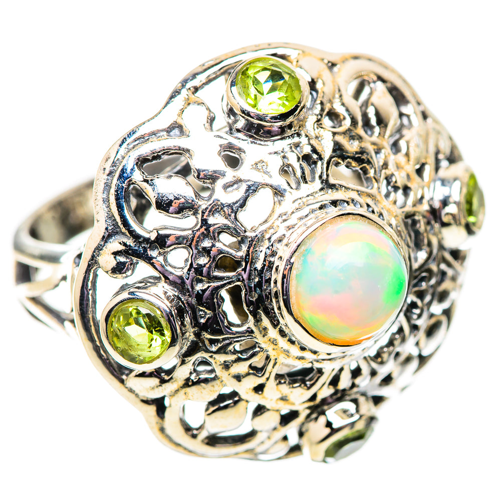 925 sterling silver filigree ring with round opal center and three peridot stones