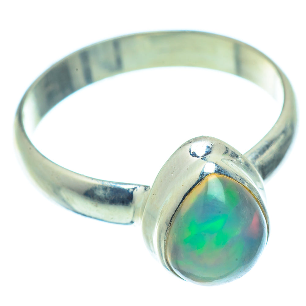 Sterling silver opal ring, oval cabochon with green and yellow iridescence.