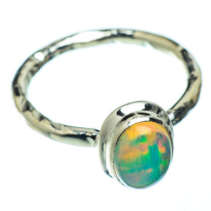 Sterling silver opal ring with oval iridescent opal bezel