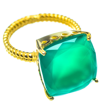 Gold ring with cushion-cut green gemstone and openwork bezel