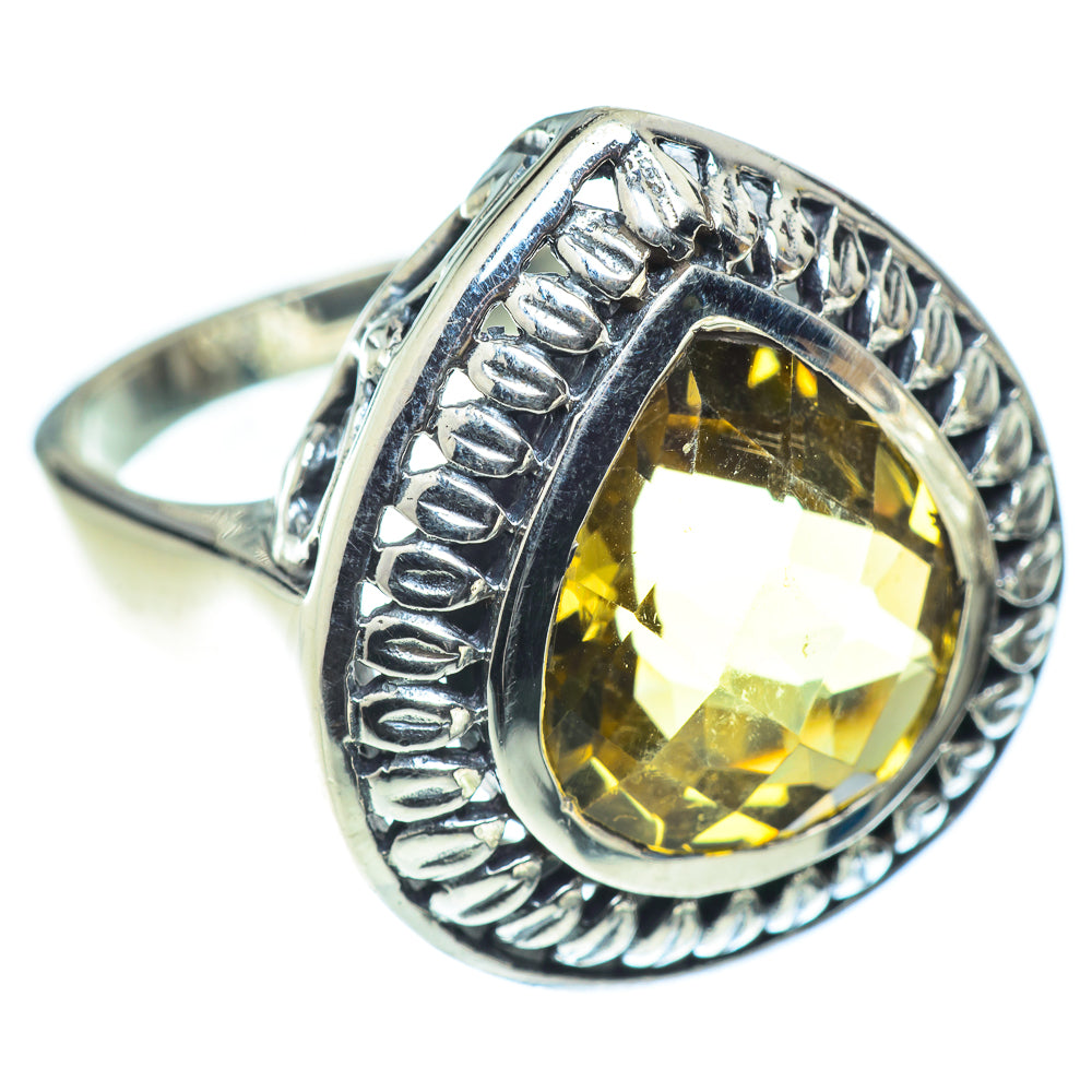Citrine statement ring with oval faceted yellow gem in detailed silver frame