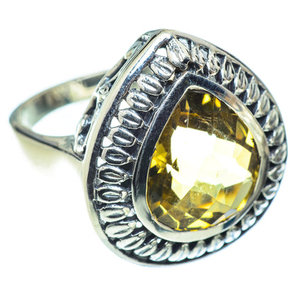 Citrine statement ring with oval faceted yellow gem in detailed silver frame