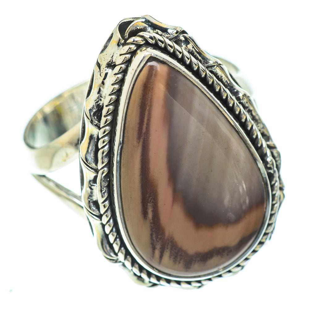 Sterling silver oval jasper ring, raised bezel with braided border, side angle view